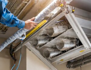 house air ducts being cleaned by a professional